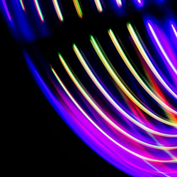 Vibrant neon lines forming a spiral of energy